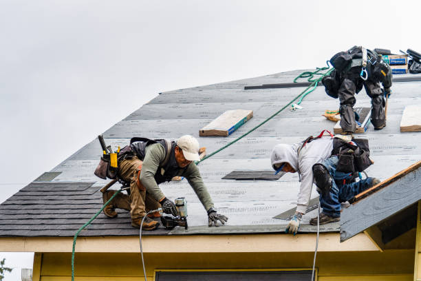 Professional Gutter Installation technician working in Groton, NY